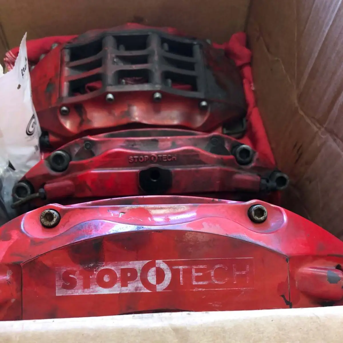 Swipe Before and After. Stoptech brake calipers rebuilt and refinished in our house red with vinyls under clear