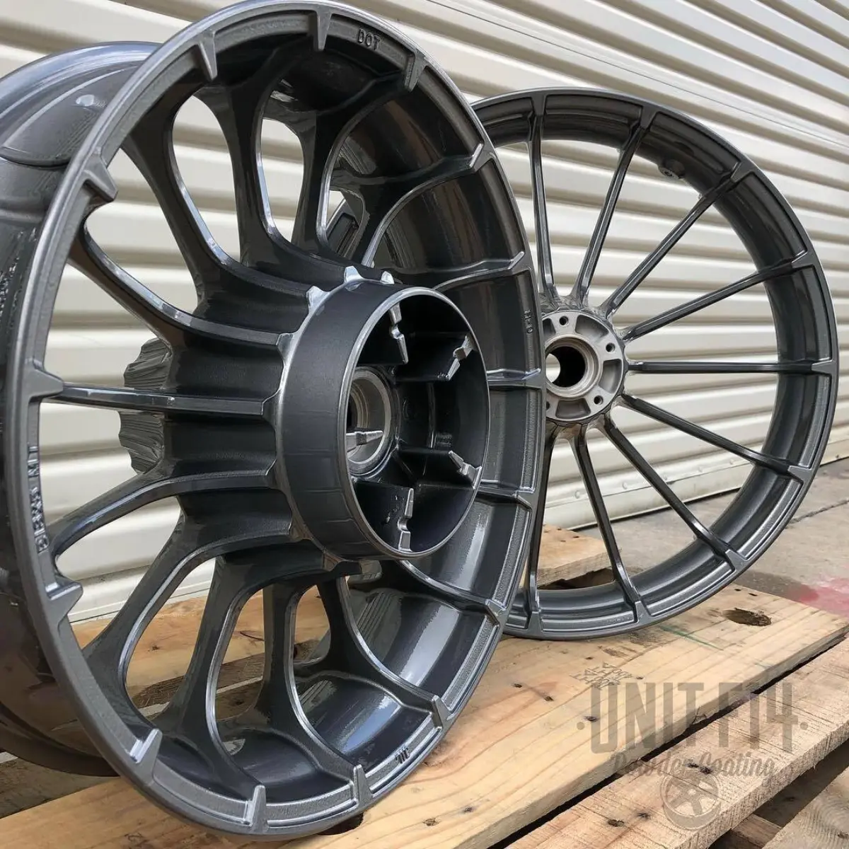 Harley Davidson wheels refinishing in a light metallic gunmetal with high gloss clear