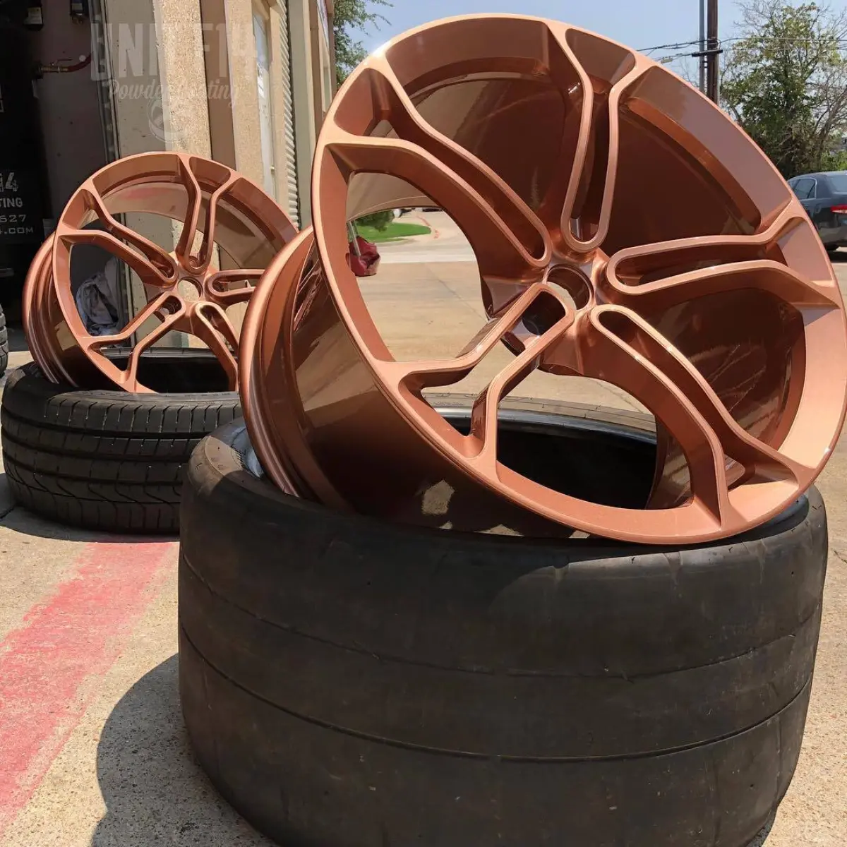 McLaren wheels refinished in a Metallic Rose Gold