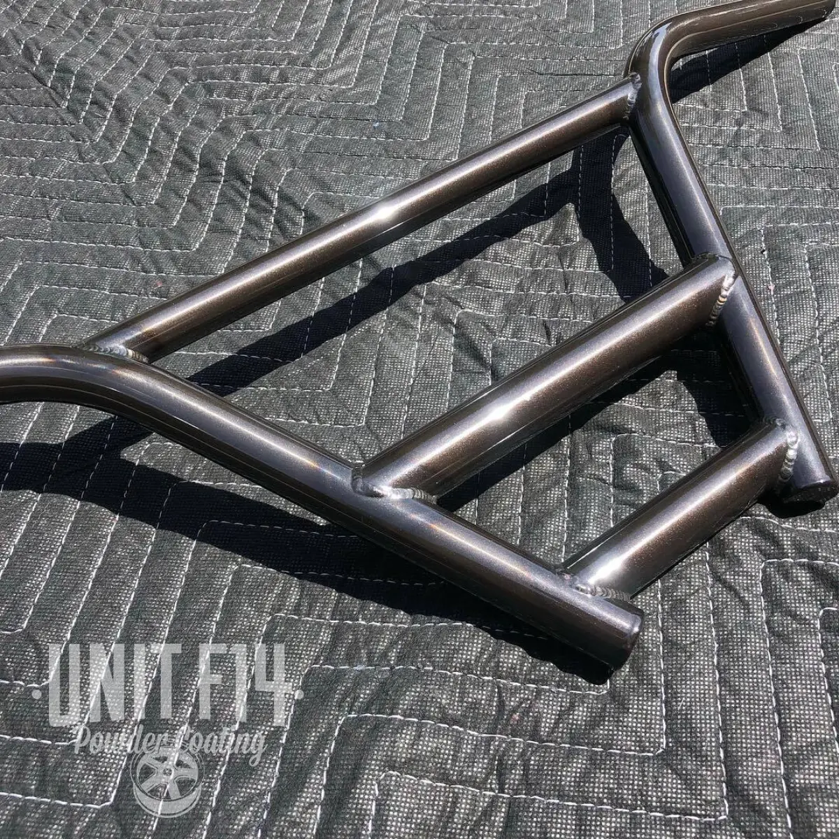 Boss Frames handle bars in Transparent Black Chrome over raw metal