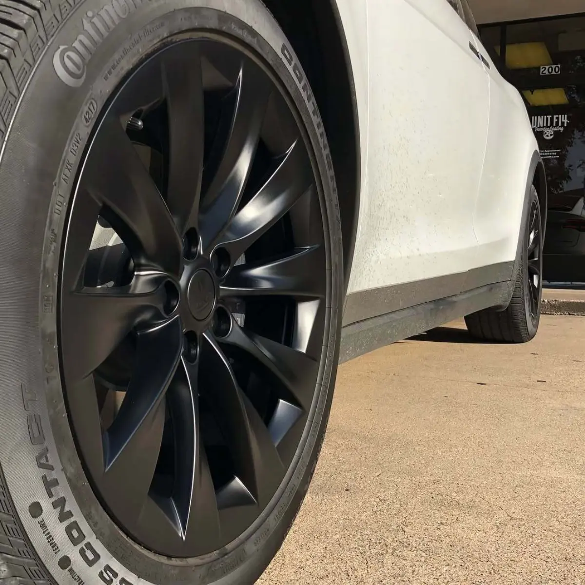 Tesla Model X wheels refinished in Denim Black