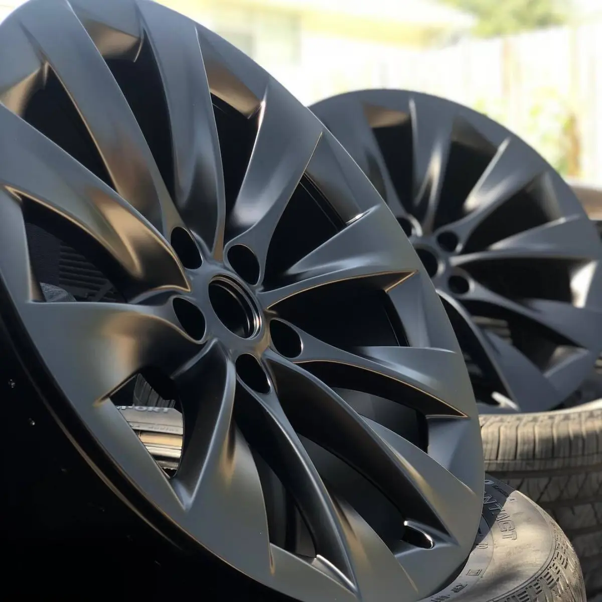 Tesla Model X wheels refinished in Denim Black