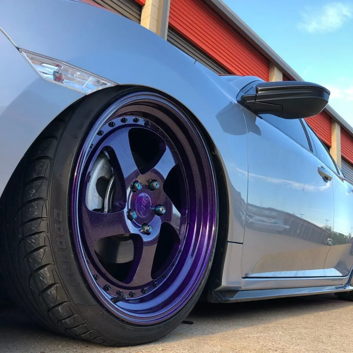 Can’t go wrong with purple wheels on a bagged civic with a galaxy roof wrap @antihousewife