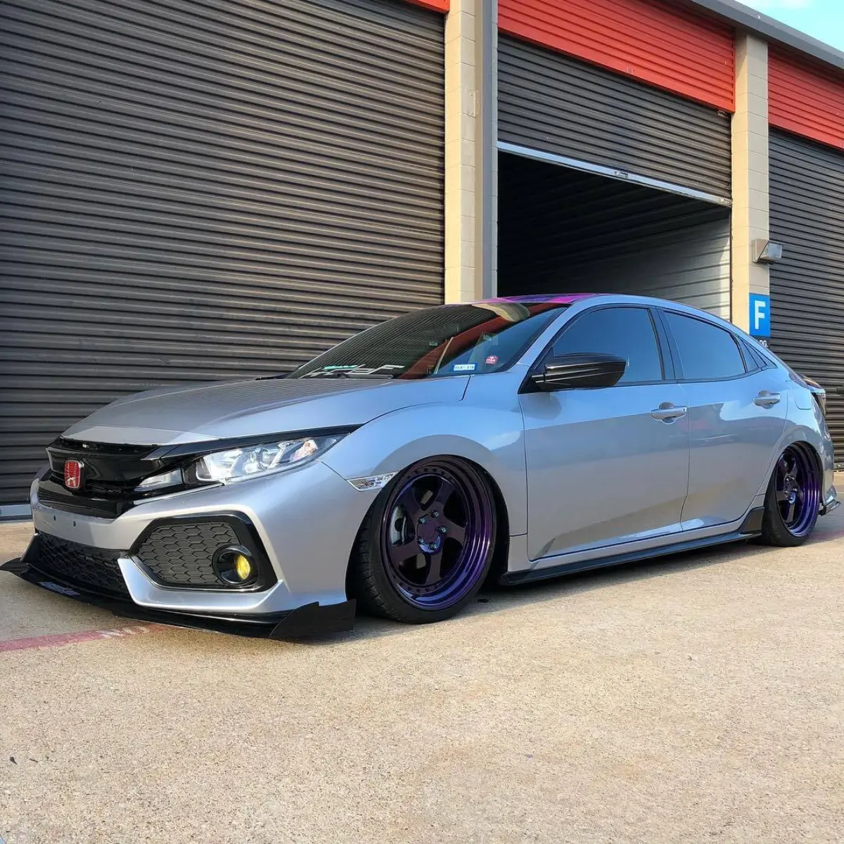 Can’t go wrong with purple wheels on a bagged civic with a galaxy roof wrap @antihousewife