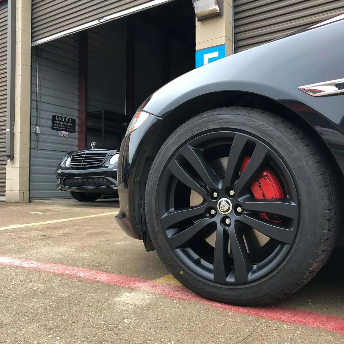 Jaguar XJ L wheels refinished in matte black
