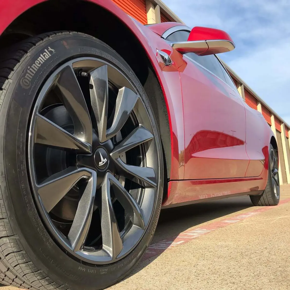 Tesla Model 3 wheels refinished in a metallic gunmetal