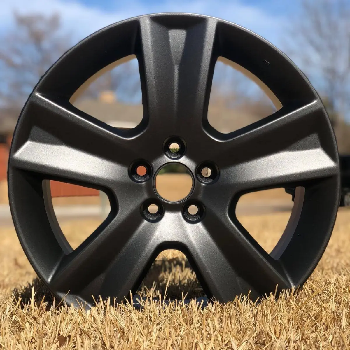 Subaru wheels powder coated in a dark satin gunmetal