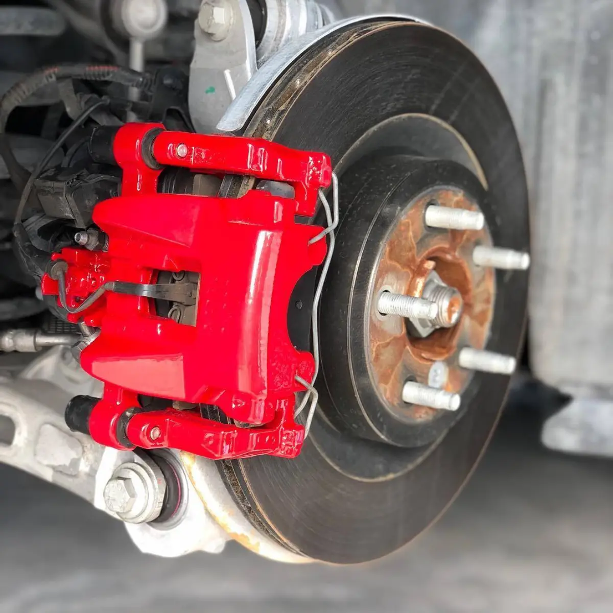Jaguar XE brake calipers powder coated in a BEAUTIFUL red