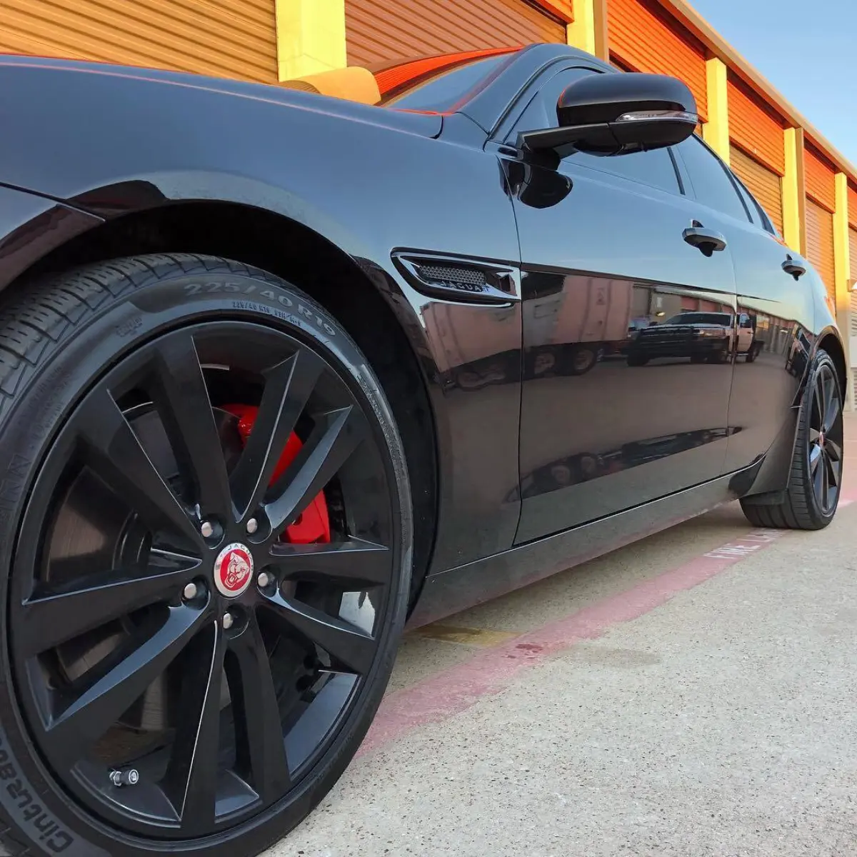 Jaguar XE brake calipers powder coated in a BEAUTIFUL red