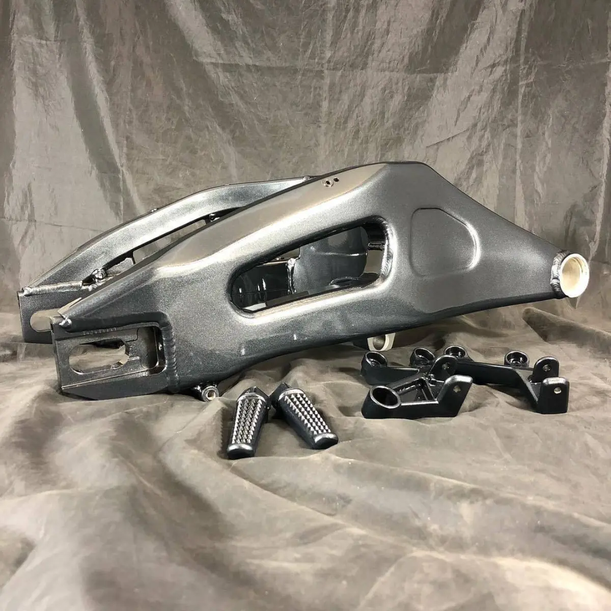 Swing arm and passenger pegs in a metallic gun metal with clear