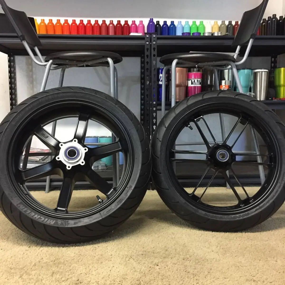 Buell wheels powder coated in Denim Black. Mount, balance and new bearings done in-house