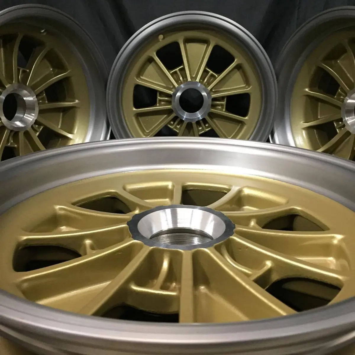 Cobra wheels with gold centers, polished lips, and satin clear