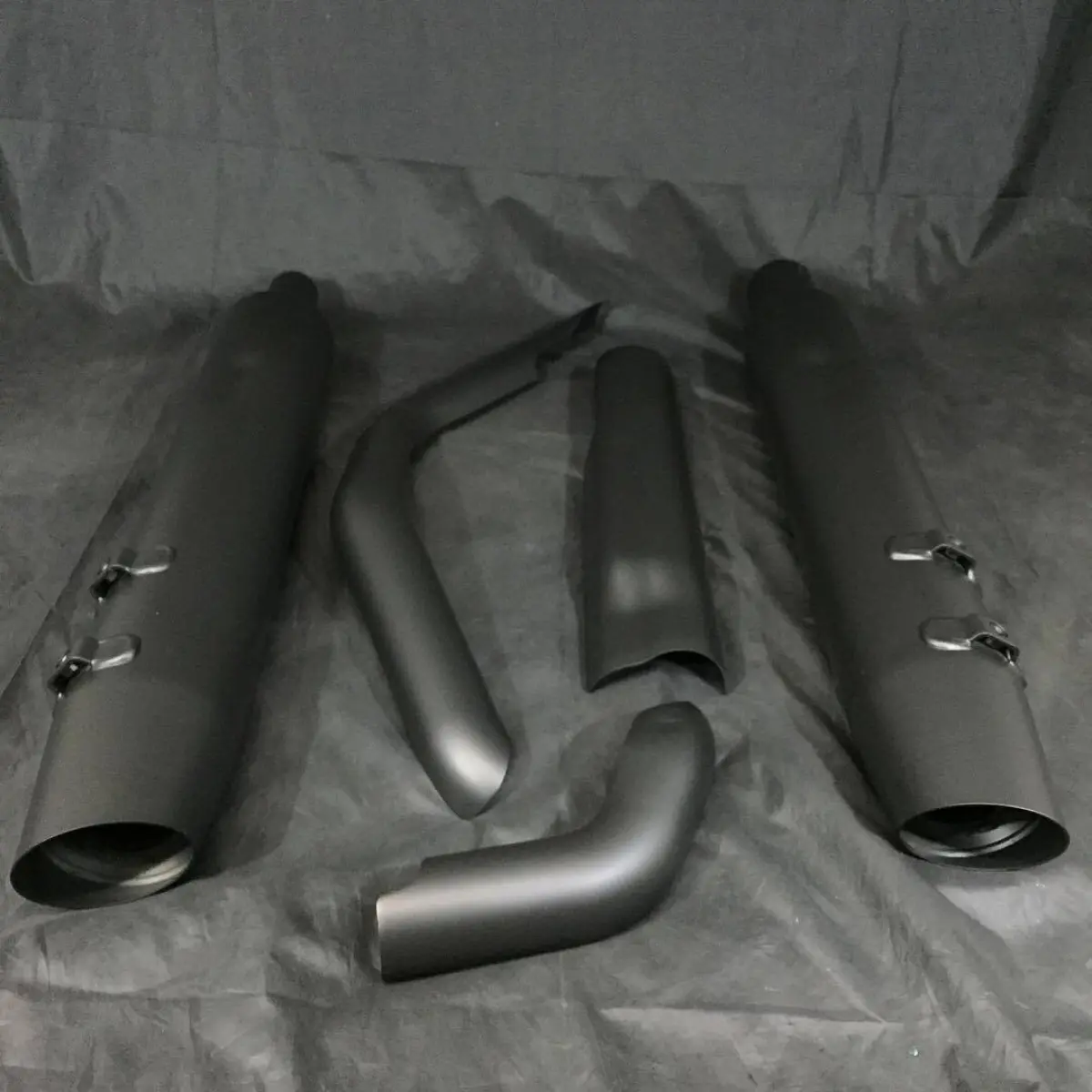Glacier Black high-temp Cerakote on a set of Harley pipes and shrouds