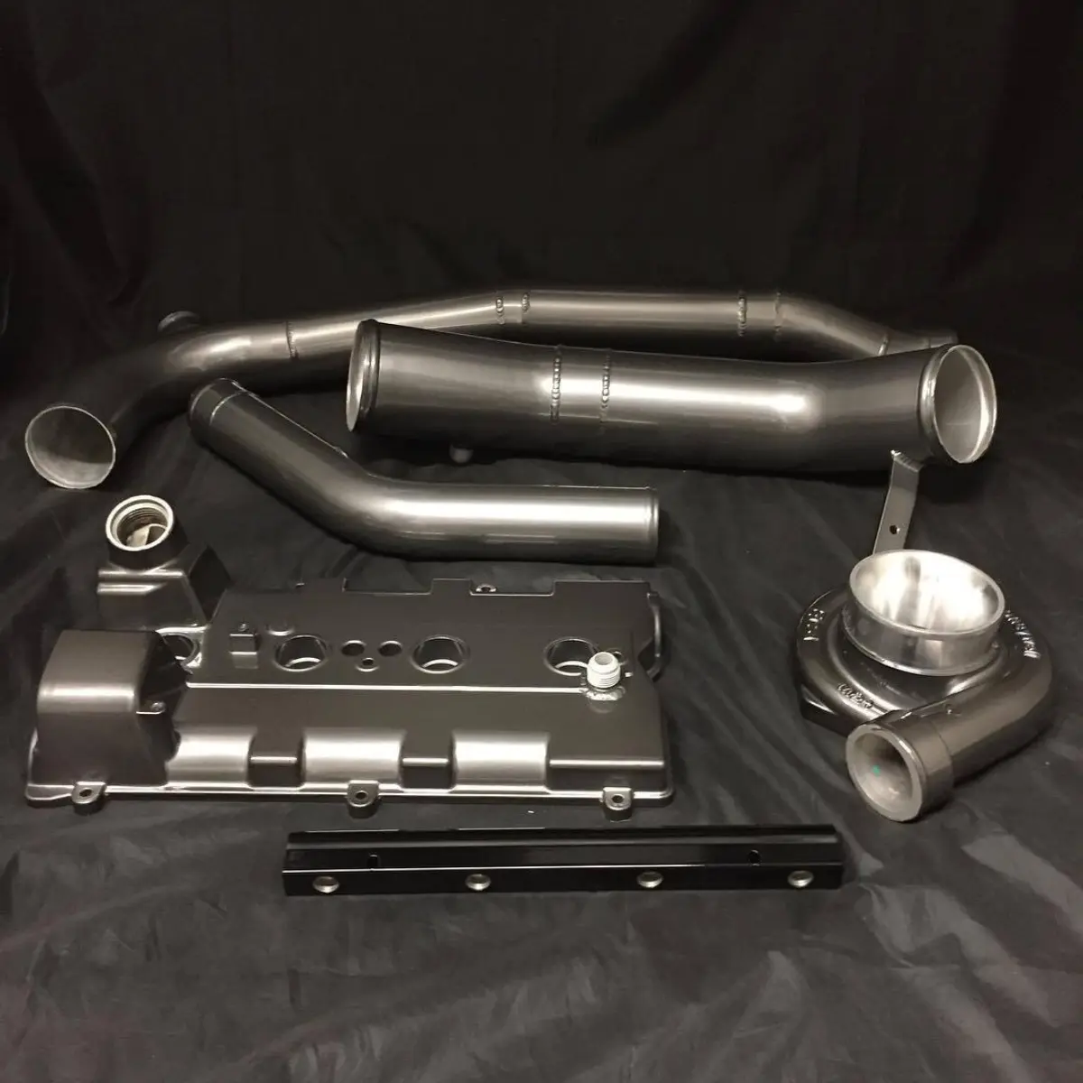 Valve cover, turbo housing, and piping in Black Chrome II