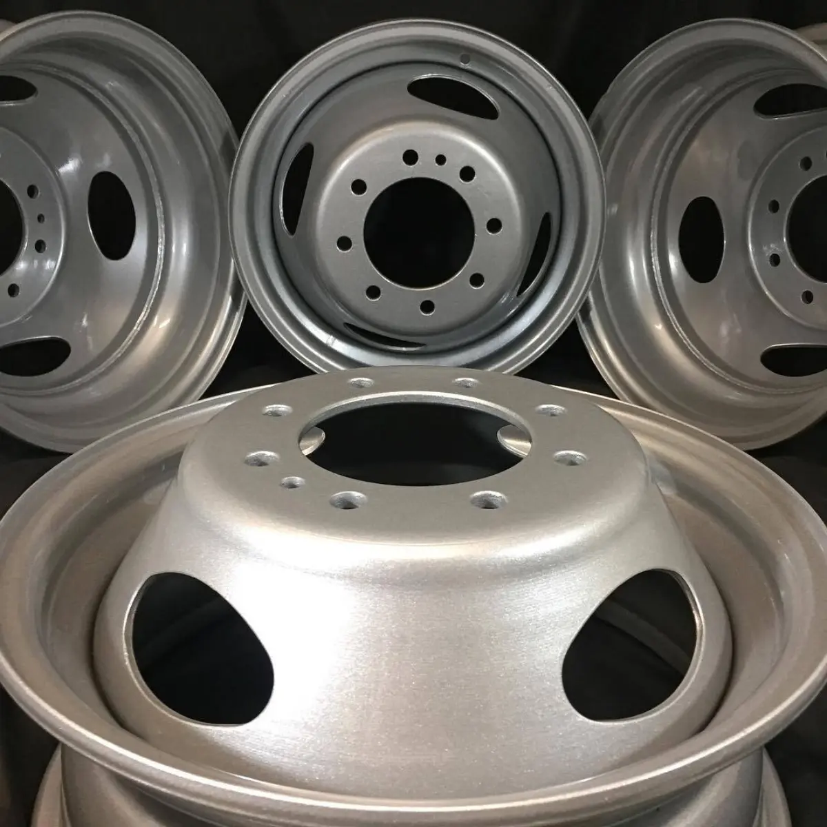 Ford F-250 steel dually wheels powder coated with zinc primer, class a silver, and clear coat