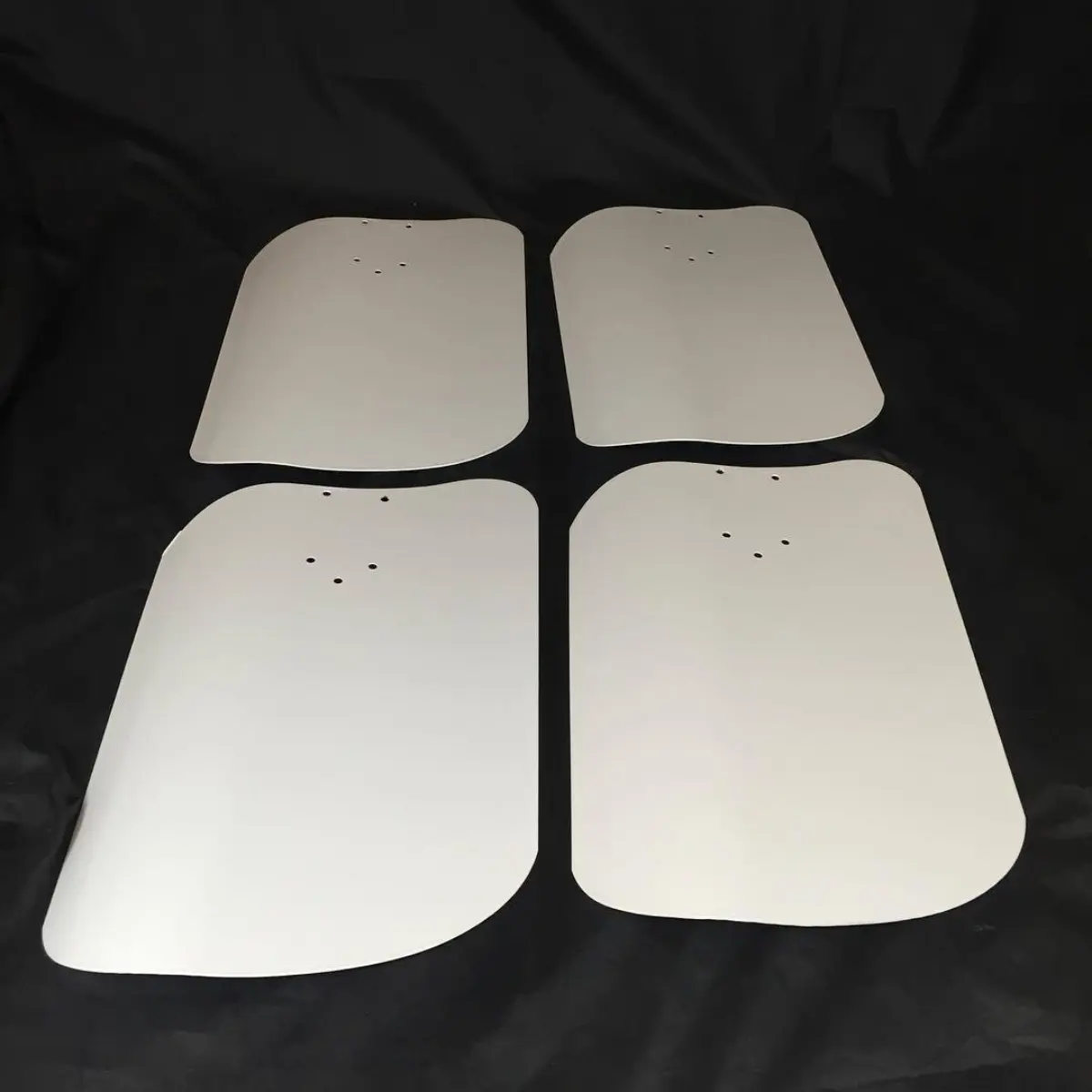 A few large industrial fan blades in high-reflective white
