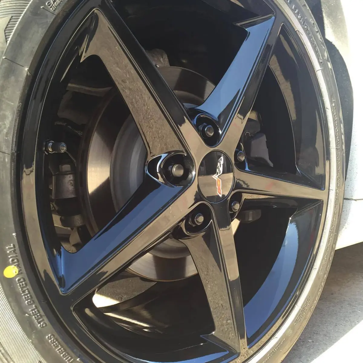 2013 Chevrolet Corvette with Wet Black rims. Matching black center caps, tpms nuts, and black wheel weights