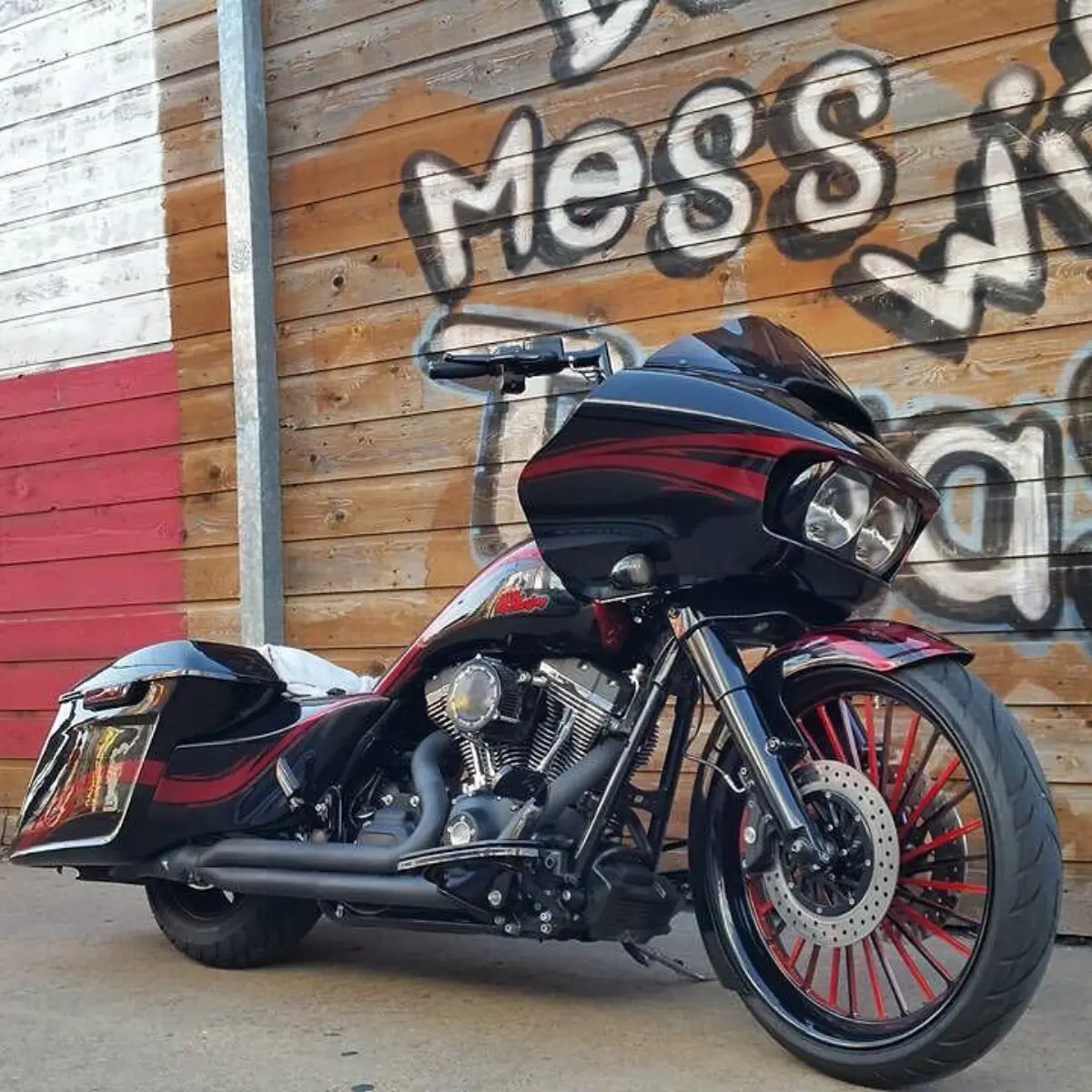 2015 Harley Davidson Road Glide. Front wheel powder coated in a 2-tone Illusion Red and Wet Black. Front end and various other components powder coated Wet Black. Valve covers in HD fine texture. Exhaust shroud in High-Temp Cerakote Jet Black. Paint