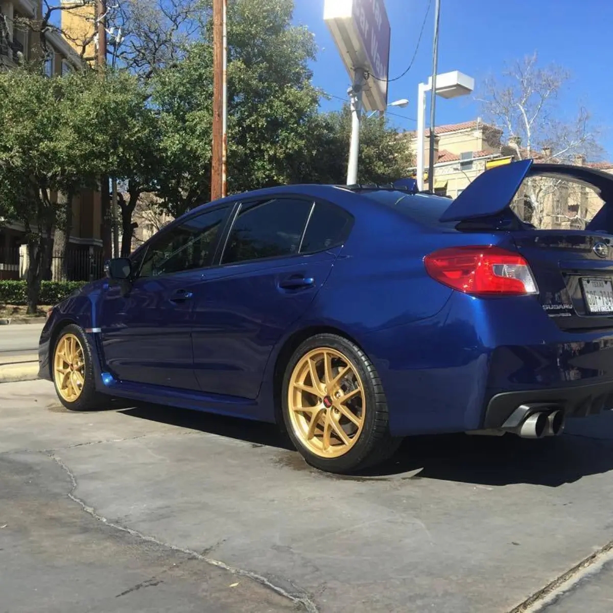 Subaru STI with Prismatic Gold powder coated rims