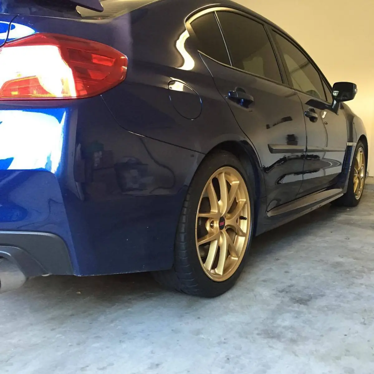 Subaru STI with Prismatic Gold powder coated rims
