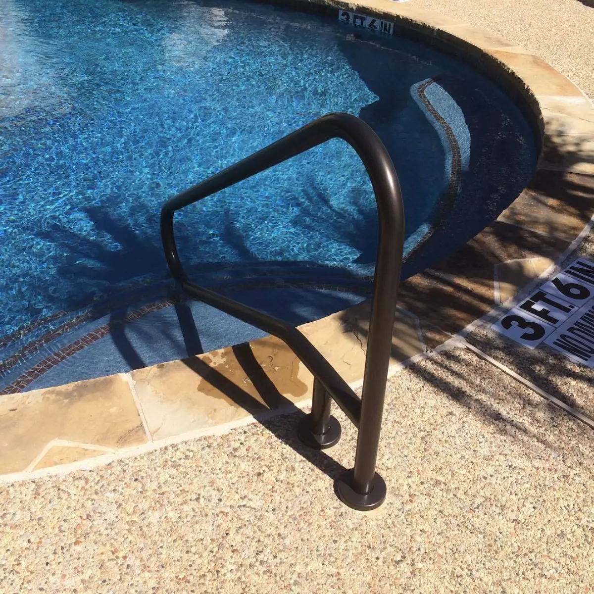Pool railing in soft rubbed bronze
