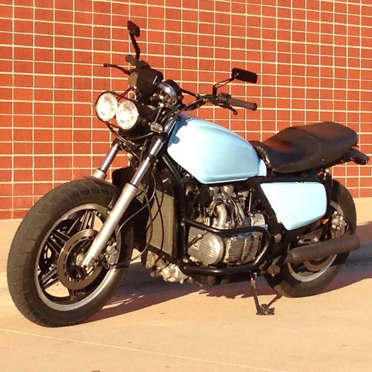 Naked goldwing with matte black crash bar, radiator shroud, and headlight brackets