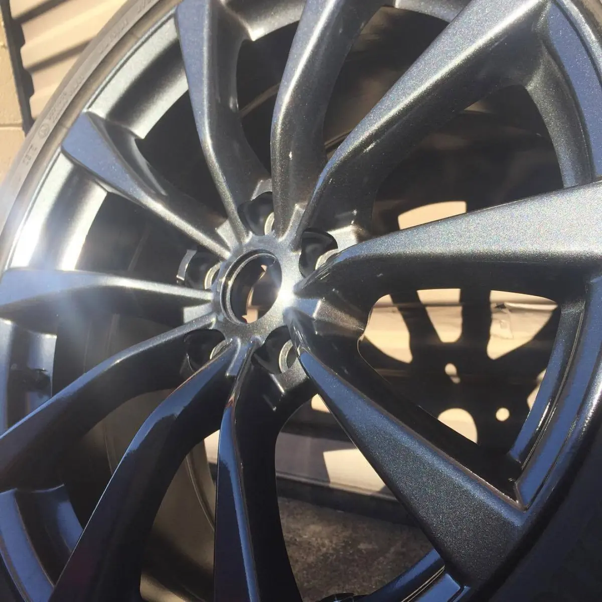 Close up of the metallic gunmetal going on a Infiniti G37s