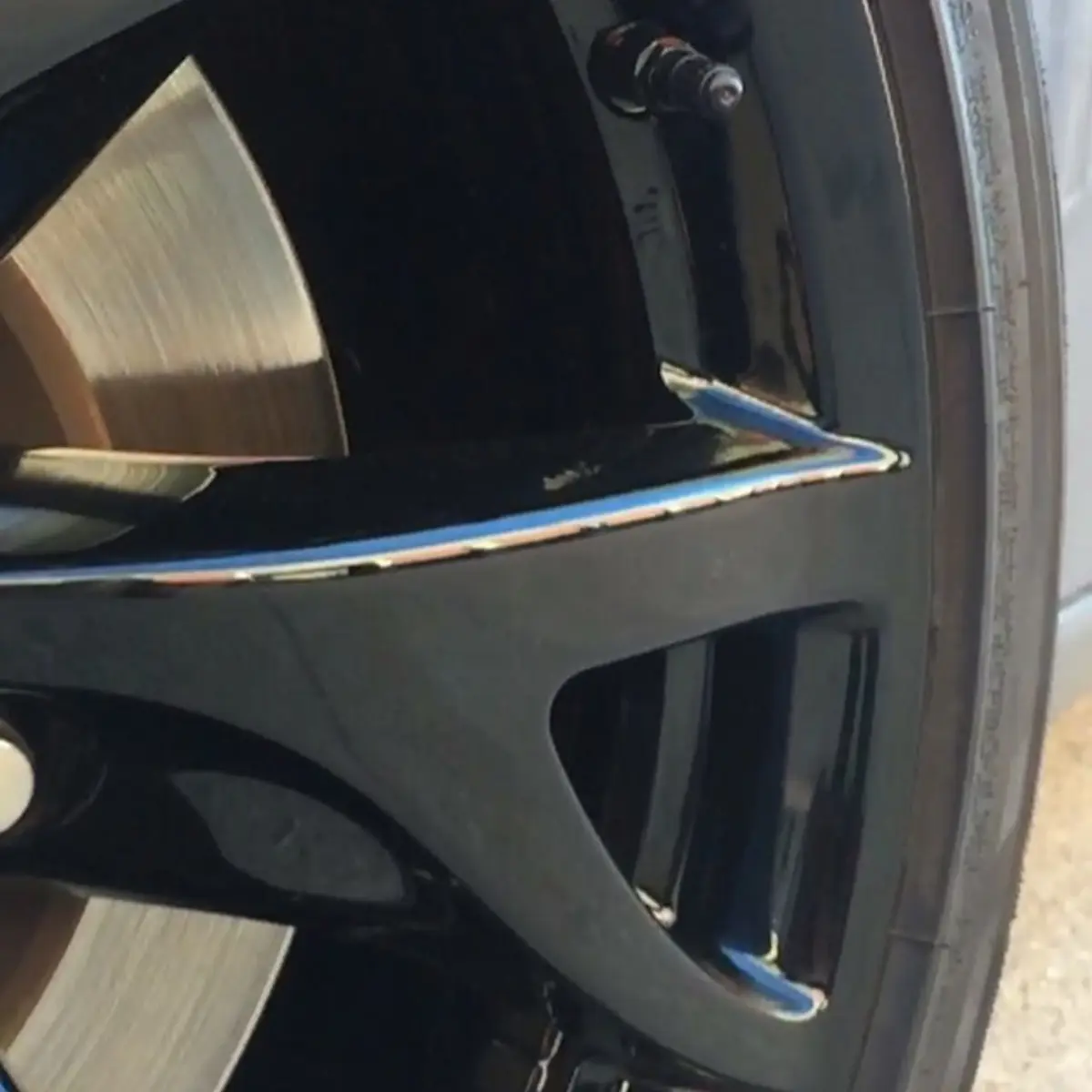 A close-up and slowed-down look at our wet black powder coat on a set of 370z rims, featuring our black wheel weights and tpms bolts