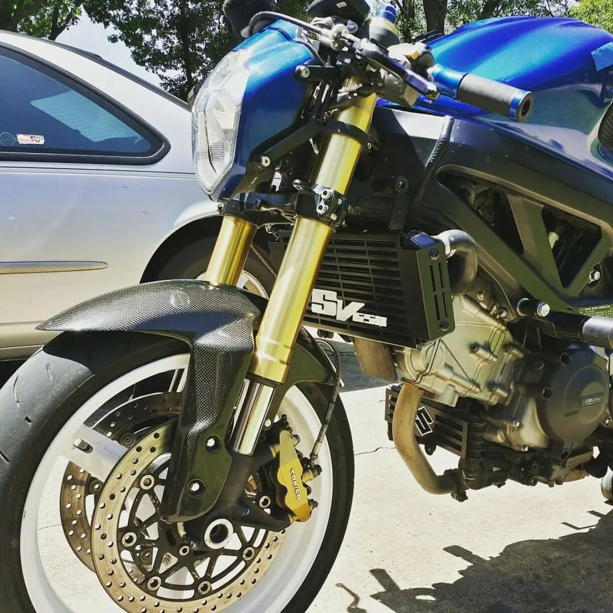@bluedreamsv got the radiator and oil cooler guards on!! Two tone black with white lettering. One of the sickest SV's out there