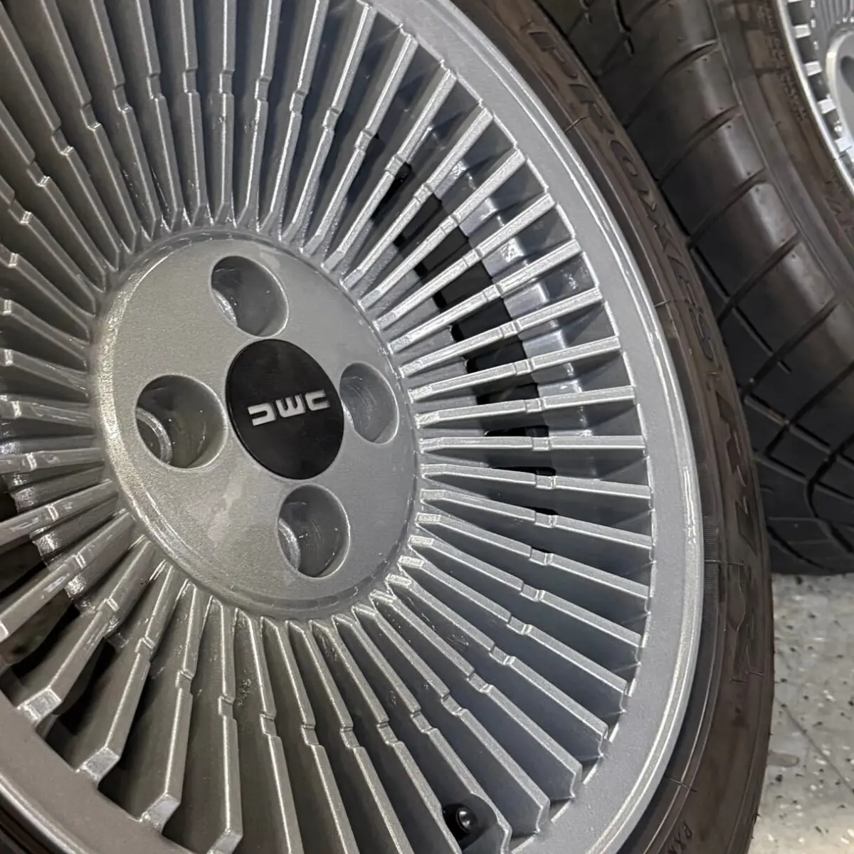 DMC DeLorean wheels refinished in Cobra Charcoal with High Gloss Clear