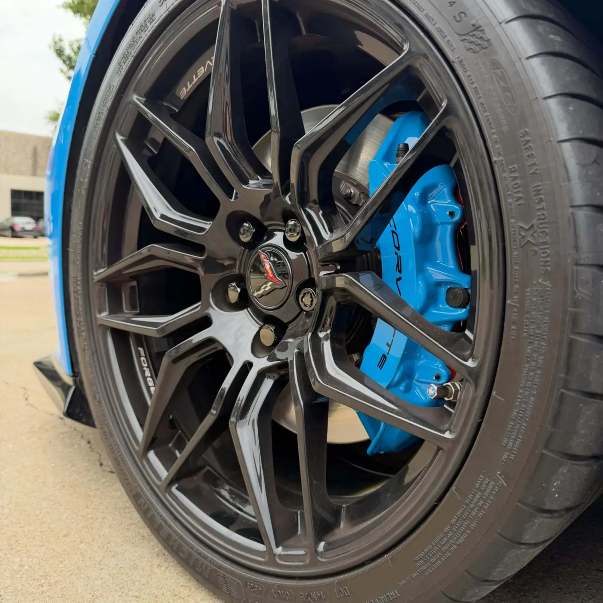 Color matched C8 Corvette brake calipers, powder coated in Chevy Rapid Blue with High Gloss Clear