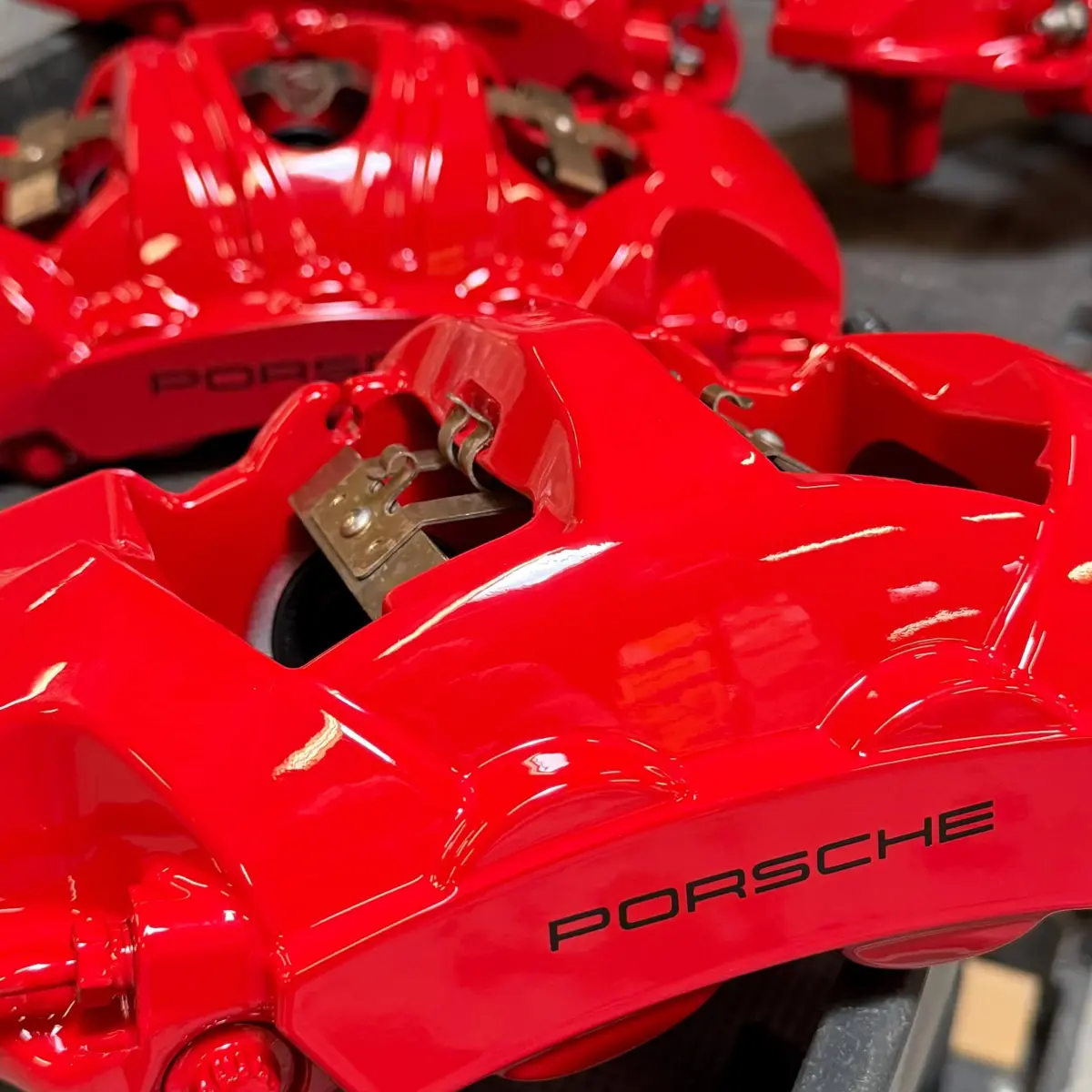 Tag teaming with @tritektint, we rebuilt and powder coated these Porsche 911 Carrera 4s brake calipers in Bengal Red with High Gloss clear