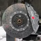 Audi R8 brake calipers refinished in a light metallic gunmetal