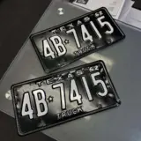 Antique license plate restoration. These were chemically stripped, sandblasted and powder coated Semigloss Black and Bengal White