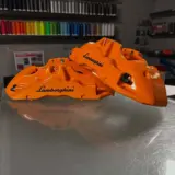 Lamborghini brake calipers powder coated Sunkist Orange with High Gloss Clear
