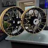 Harley Davidson wheels and parts powder coated Spanish Gold and Gloss Black