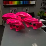 2014 Jeep Grand Cherokee SRT brake calipers rebuild and powder coated in Sassy Pink with High Gloss Clear