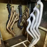 Exhaust parts refinished in Cerakote Glacier Silver, Burnt Bronze, and Glacier Black