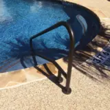 Pool railing in soft rubbed bronze